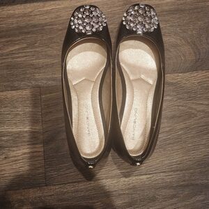 Black flat shoes.